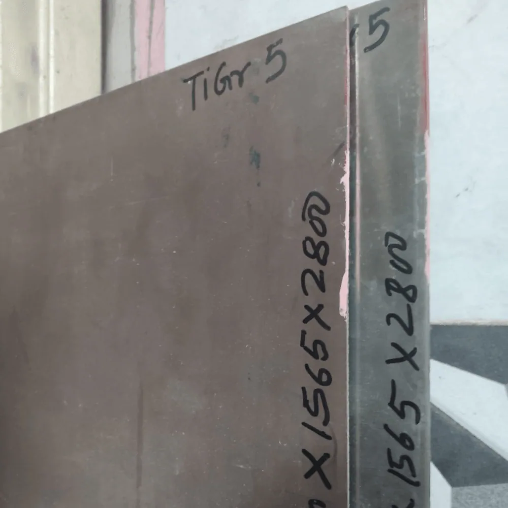 Titanium Grade 5 plates hand-marked Ti Gr 5 with their 1565 x 2800 cut size