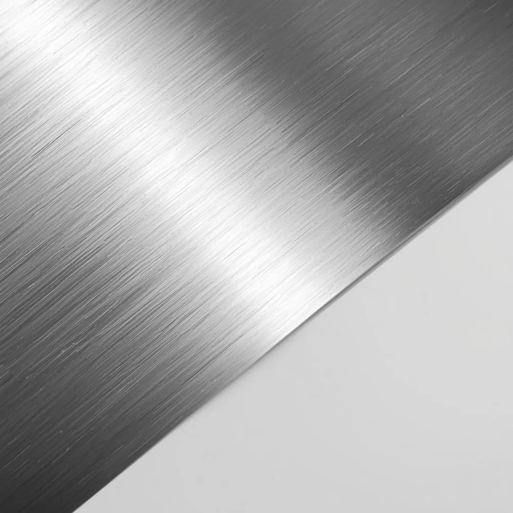 Sheet of brushed Hastelloy foil on a plain background